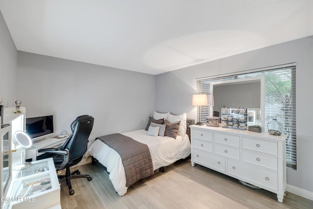 bedroom with light hardwood / wood-style floors