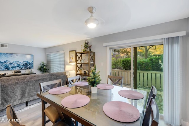 dining space featuring light hardwood / wood-style floors