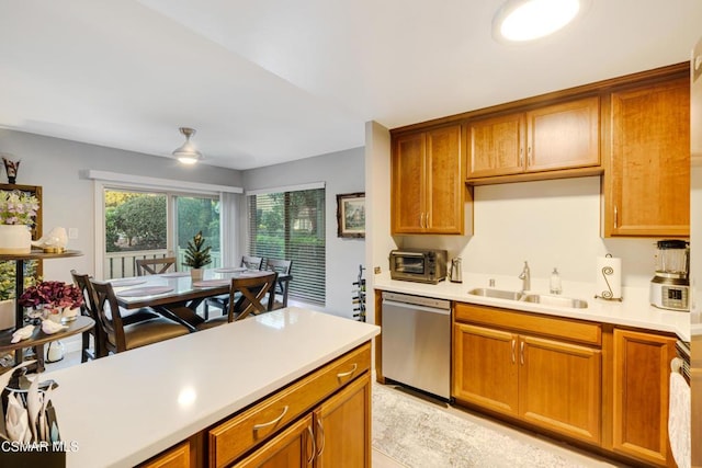 kitchen with ceiling fan, sink, range, and dishwasher