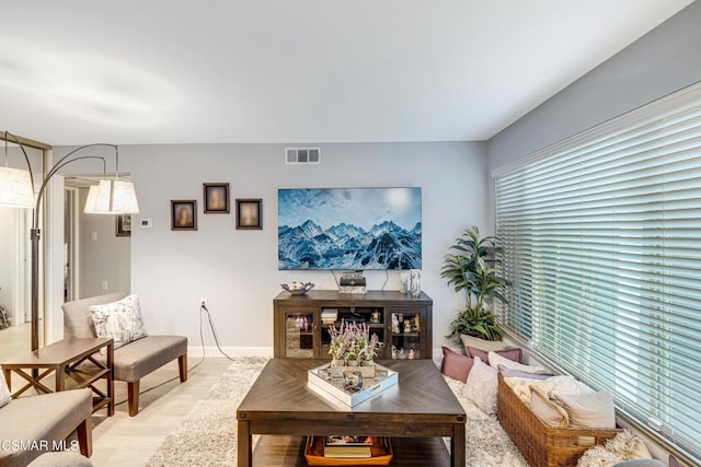 living room with light hardwood / wood-style floors