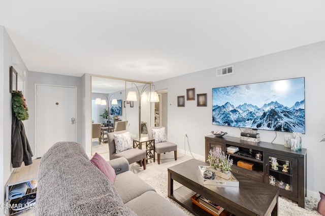 living room with light hardwood / wood-style floors