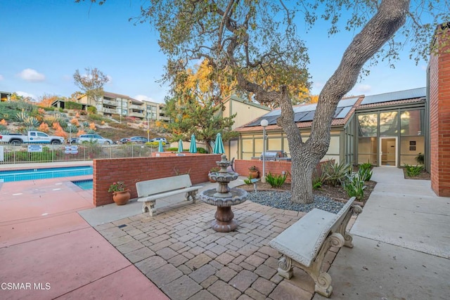 view of patio / terrace featuring a lanai and a fenced in pool