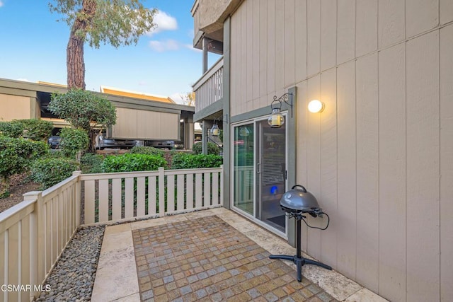 view of patio / terrace with grilling area and a balcony