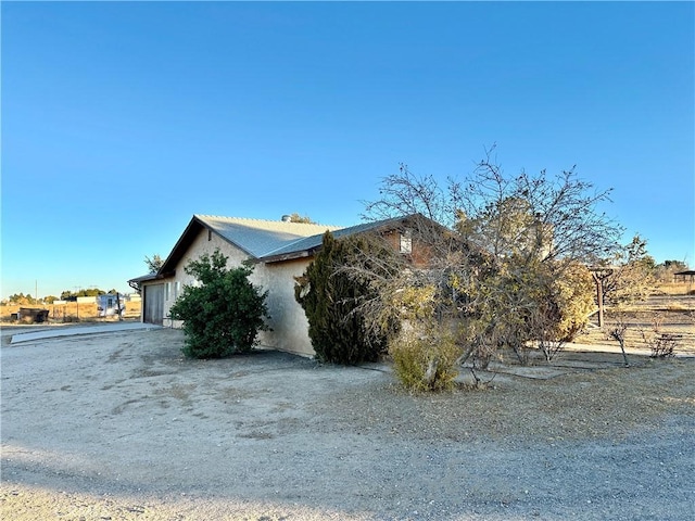 view of home's exterior with a garage