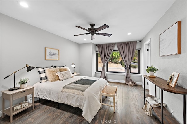 bedroom featuring dark hardwood / wood-style flooring and ceiling fan