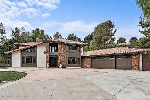 mediterranean / spanish-style home featuring a garage