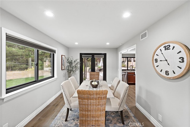 dining room featuring dark hardwood / wood-style floors and sink