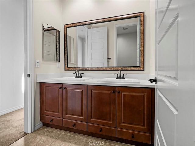26420 Township St, Saugus, CA 91350 - bathroom with baseboards, double vanity, a sink, and visible vents