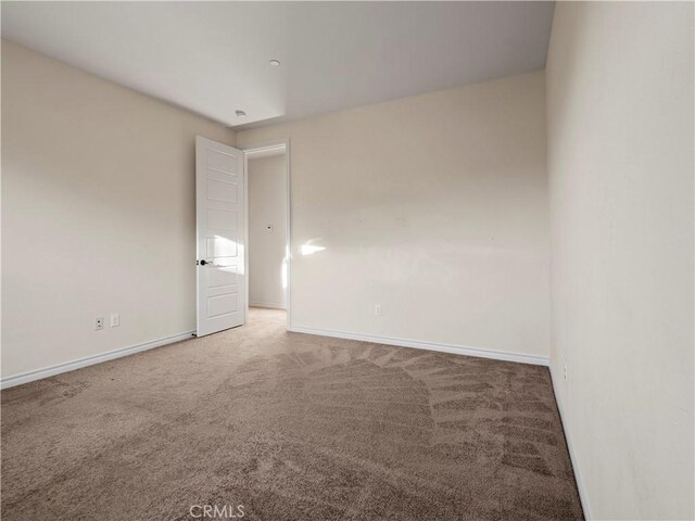 empty room with carpet flooring