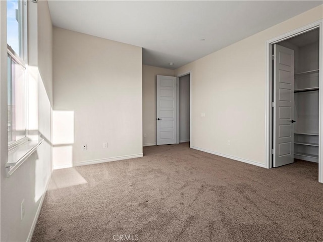 26420 Township St, Saugus, CA 91350 - unfurnished bedroom with baseboards, multiple windows, and carpet