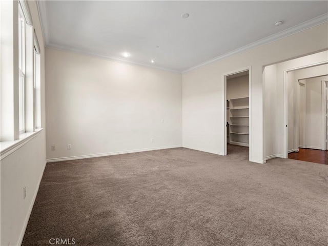 26420 Township St, Saugus, CA 91350 - unfurnished bedroom featuring a walk in closet, carpet, baseboards, and ornamental molding