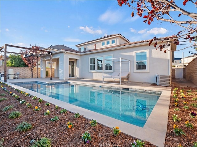 26420 Township St, Saugus, CA 91350 - back of house with an outdoor pool, fence, a patio, and stucco siding