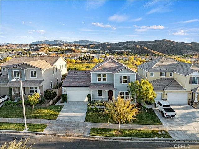 26420 Township St, Saugus, CA 91350 - traditional-style house featuring concrete driveway, a residential view, a mountain view, a front lawn, and an attached garage