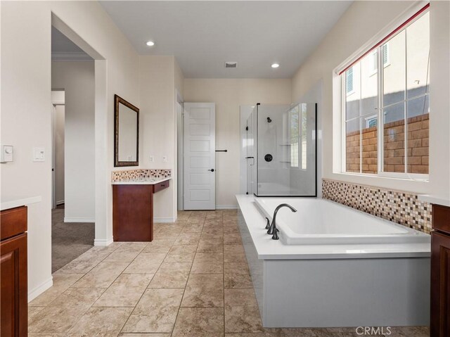 bathroom with vanity, tile patterned floors, and separate shower and tub