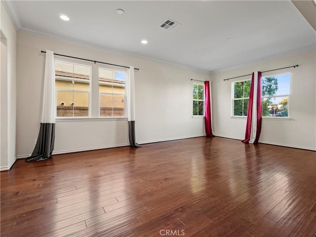 unfurnished room featuring crown molding and dark hardwood / wood-style floors