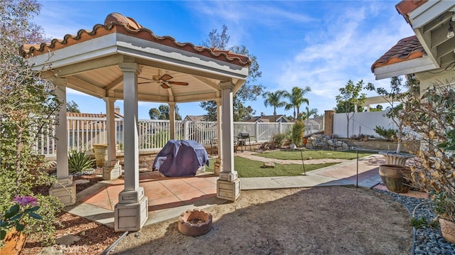 view of patio / terrace featuring a gazebo and ceiling fan