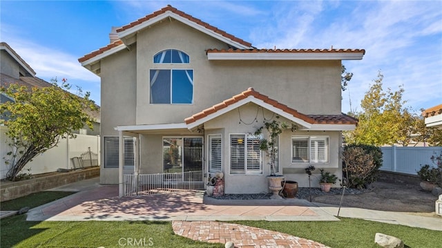 rear view of house featuring a patio area