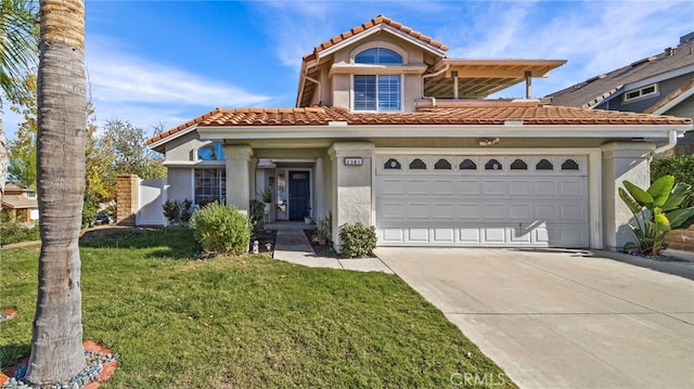 view of front of property with a front yard and a garage