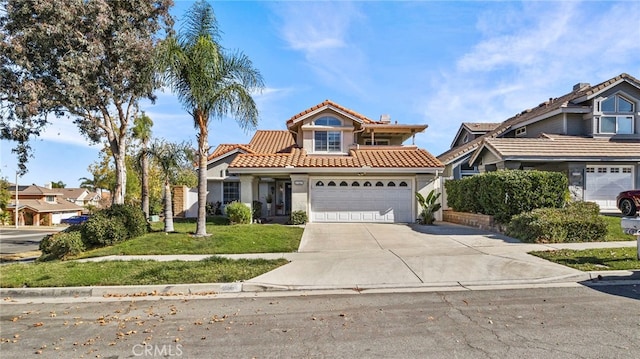 view of front of property featuring a garage and a front lawn