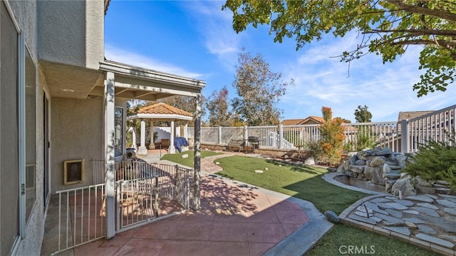 view of yard featuring a gazebo and a patio