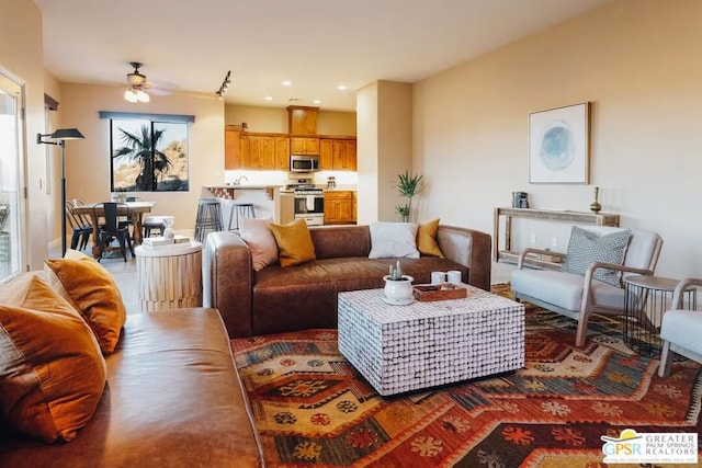 living room with ceiling fan