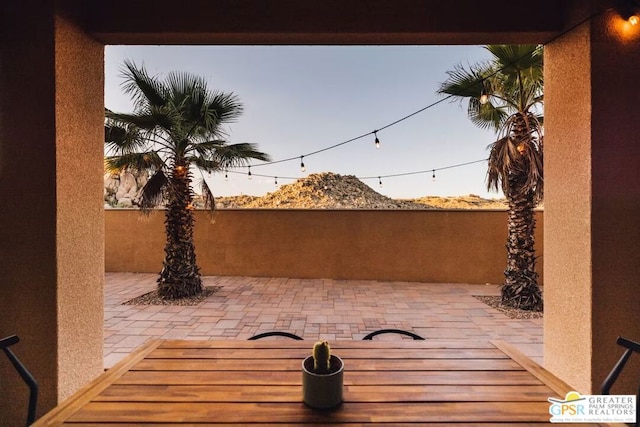 view of patio terrace at dusk