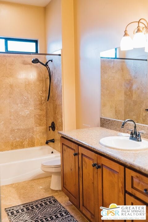 full bathroom featuring tile patterned flooring, vanity, toilet, and tiled shower / bath