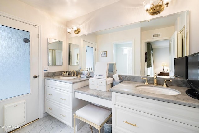 bathroom featuring vanity and tile patterned floors