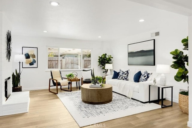 living room with light hardwood / wood-style floors