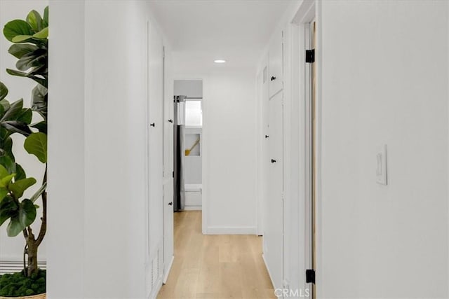 hallway featuring light hardwood / wood-style floors