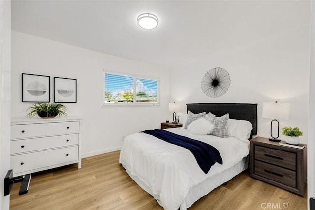 bedroom with light hardwood / wood-style floors