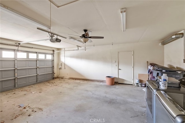 garage featuring ceiling fan, independent washer and dryer, and a garage door opener