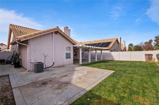 back of property featuring a pergola, a yard, cooling unit, and a patio