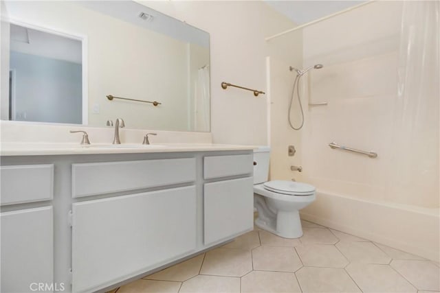 full bathroom with vanity, tile patterned flooring, shower / bath combo with shower curtain, and toilet