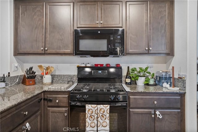 kitchen with dark brown cabinetry and black appliances