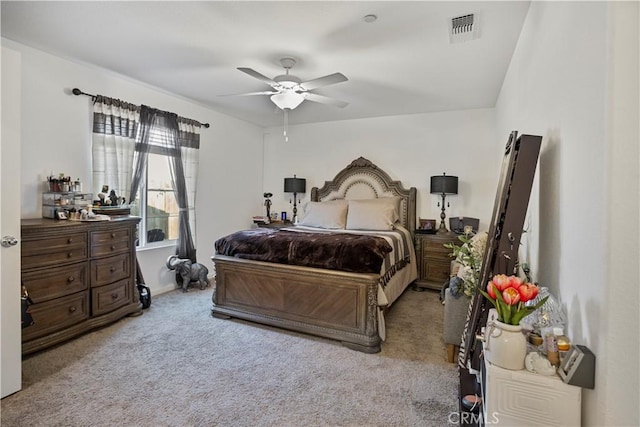 bedroom featuring ceiling fan and light colored carpet