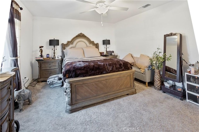 bedroom with ceiling fan and light carpet