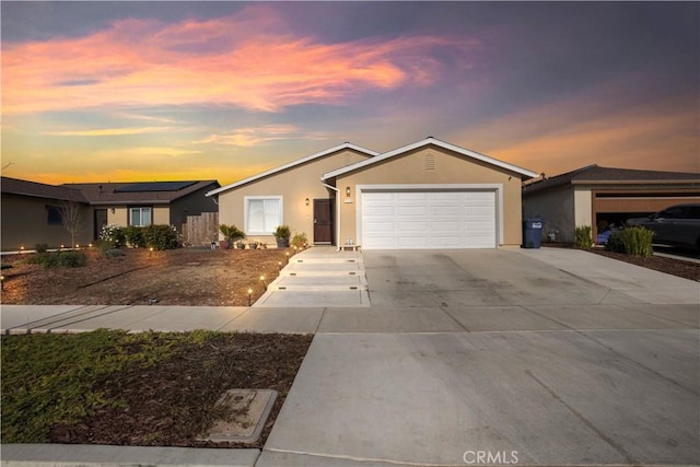 single story home featuring a garage