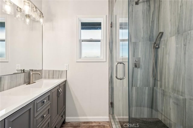 bathroom with vanity and an enclosed shower