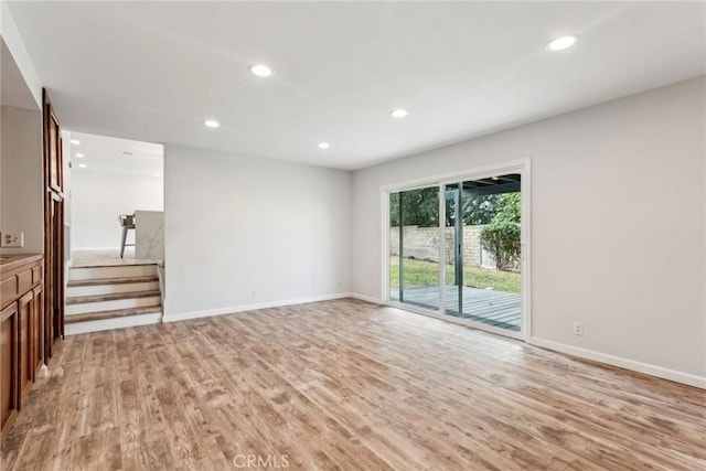 unfurnished living room featuring light wood-type flooring