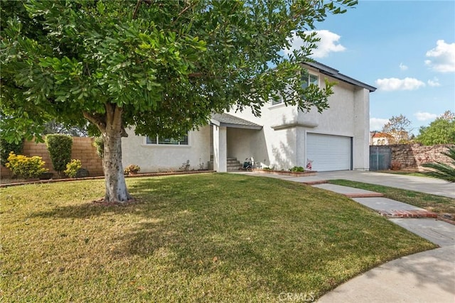 view of front of property featuring a garage and a front yard