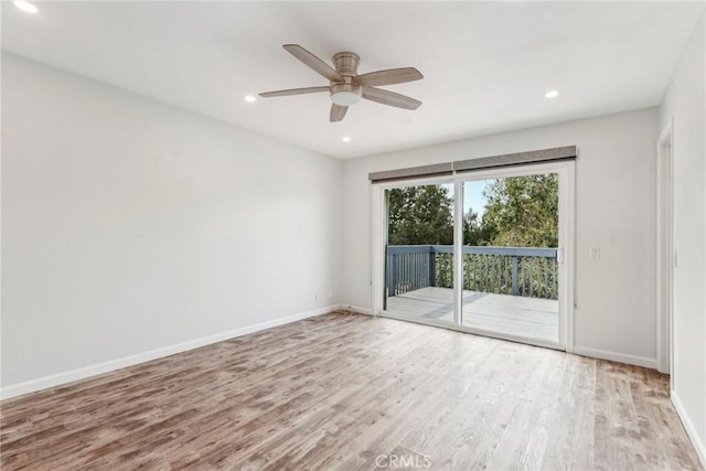 spare room with ceiling fan and light hardwood / wood-style floors