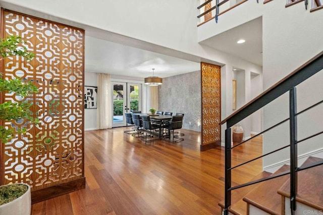 interior space with hardwood / wood-style floors and french doors