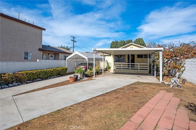 1119 E Colon St, Wilmington, CA 90744 - exterior space featuring a carport and concrete driveway