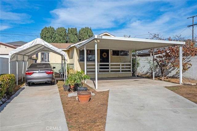 view of front of property featuring a carport