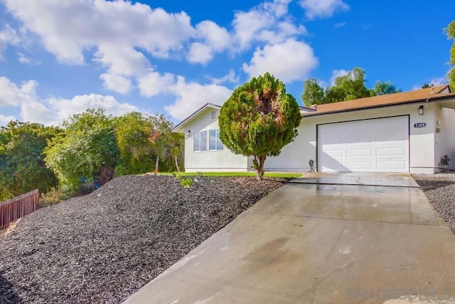 ranch-style home featuring a garage