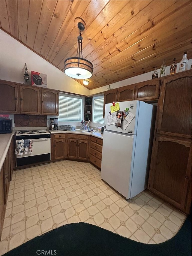 kitchen with pendant lighting, lofted ceiling, white appliances, wooden ceiling, and sink