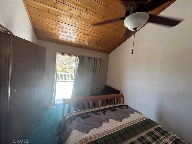 carpeted bedroom featuring ceiling fan, wooden ceiling, and vaulted ceiling