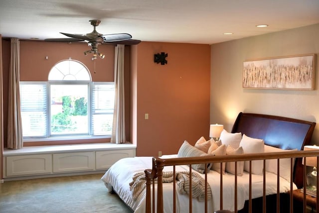 bedroom with light carpet and ceiling fan