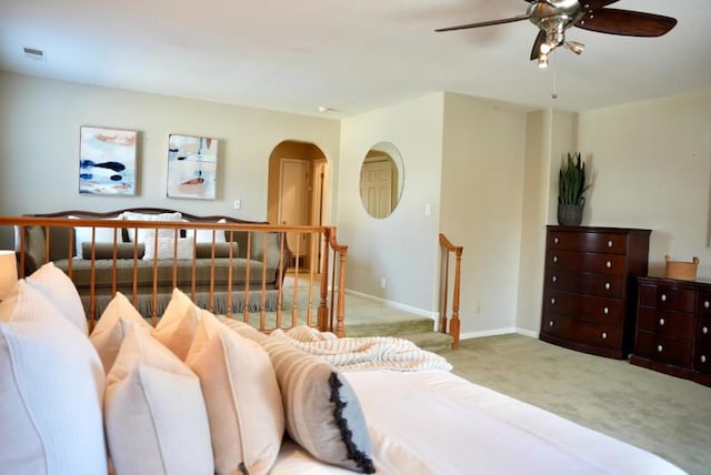 bedroom with ceiling fan and light colored carpet